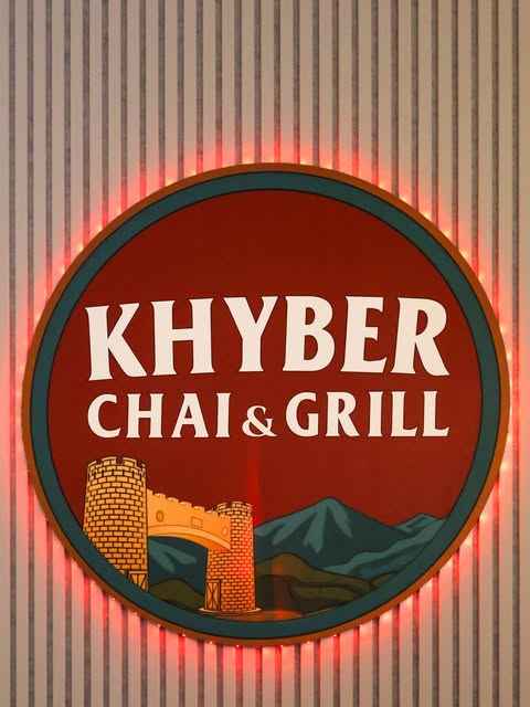 Khyber Chai & Grill’s illuminated logo photographed by SK Media